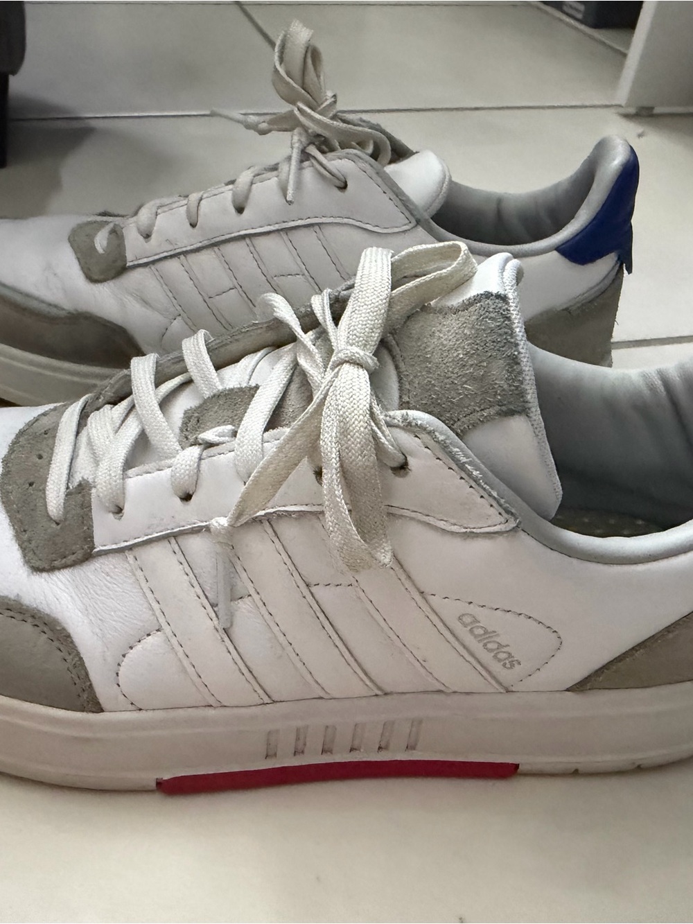 adidas White and Gray Low-Top Sneakers with Blue Heel and Red Sole Accent